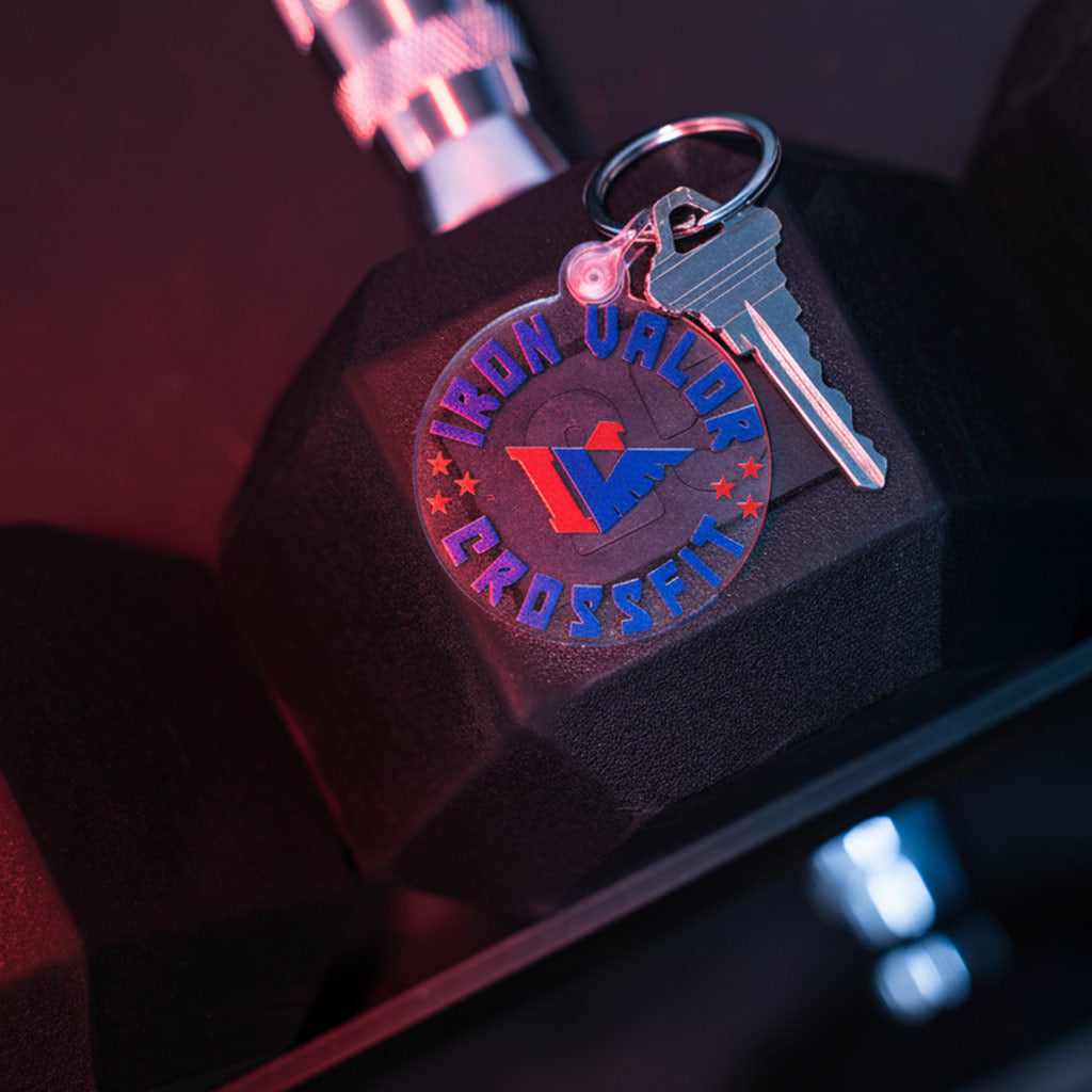 Keychain with 'Iron Valor CrossFit' logo on a black background
