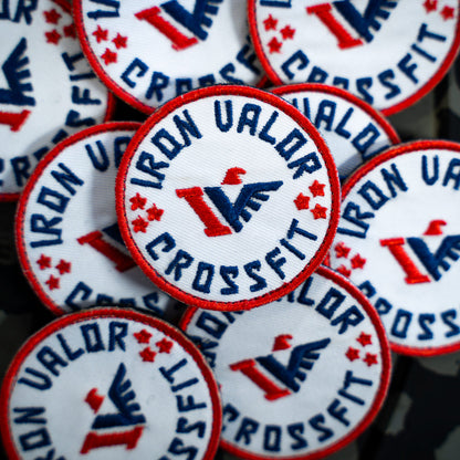 Collection of Iron Valor CrossFit patches with red, white, and blue colors.