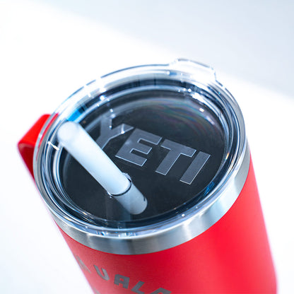 Red YETI tumbler with a clear lid featuring the YETI logo on a white background.